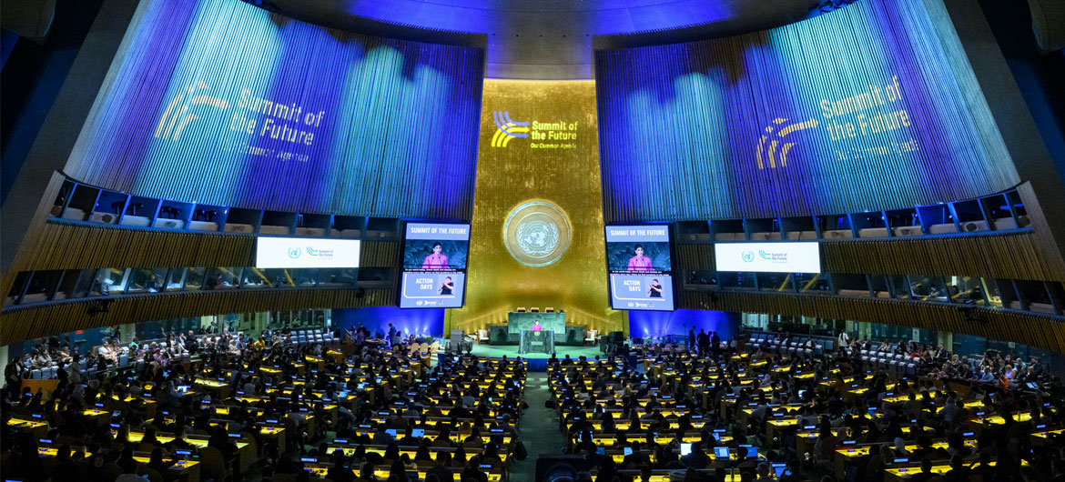 ©UN Photo/Loey Felipe UN General Assembly hall wide view shown as is it lit up with the colors and logo of the Summit of the Future